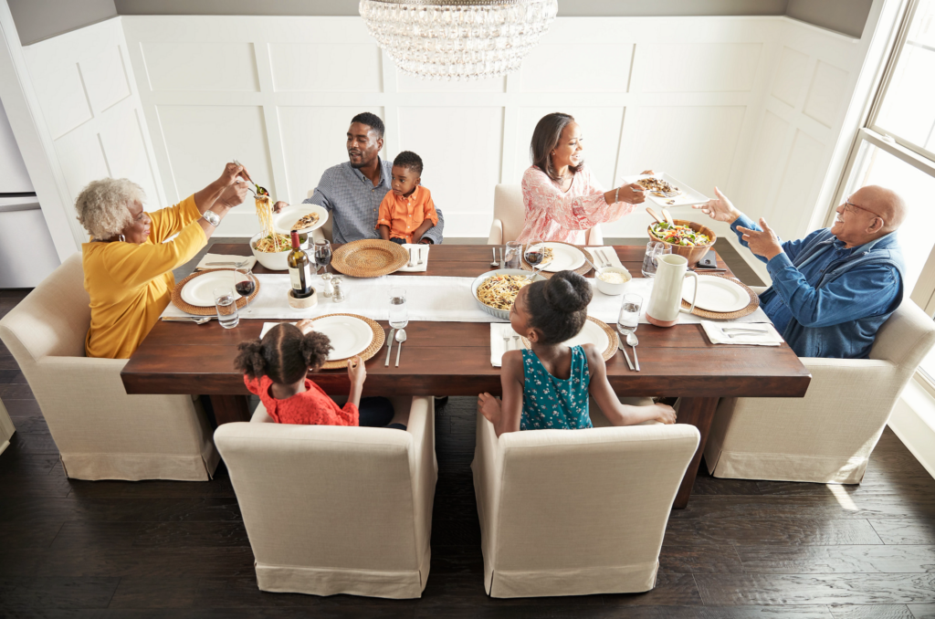 Family having breakfast at the dining table | Flooring By Design NC